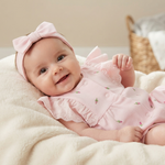 A romper in soft pink, decorated with small floral embroidery and elegant ruffles on the sleeves 17274