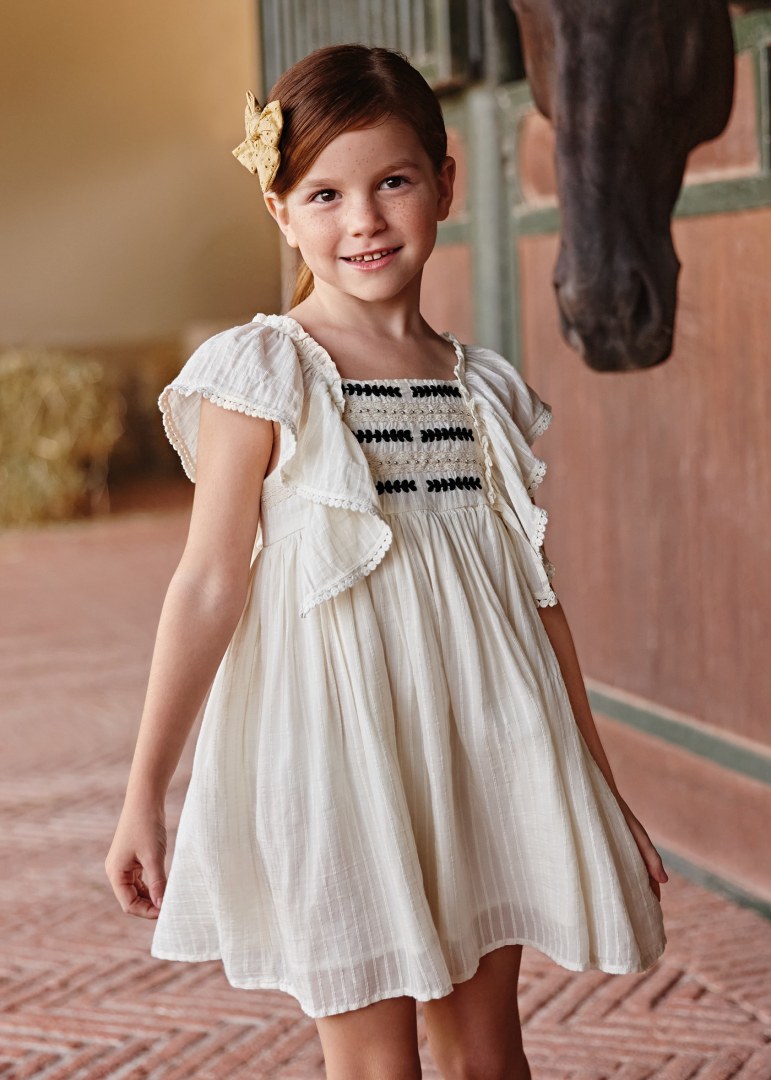 Dress with ruffles and embroidered motifs for a girl Art. 23-03926-094